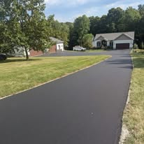 Smooth black asphalt driveway
