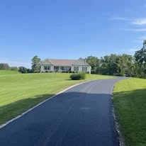 Long gravel-to-asphalt driveway